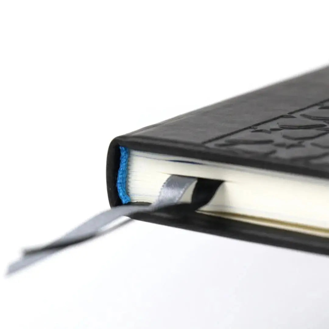 Flat lay of the Muslim Planner Undated 2025 on a desk – perfect for Muslim professionals and students seeking Islamic productivity.